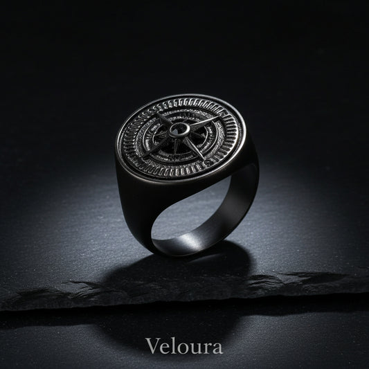 Silver ring with intricate design on a white background
